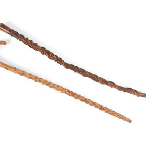 Two Folk Art Carved Walking Sticks
comprising