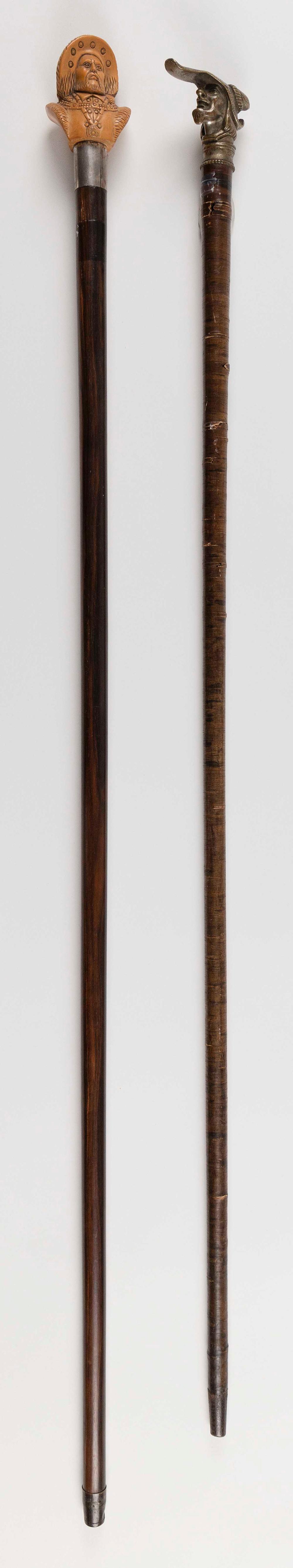 TWO WALKING STICKS WITH FIGURAL HANDLESTWO