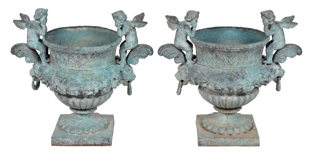 PAIR OF CAST IRON GARDEN URNS SECOND