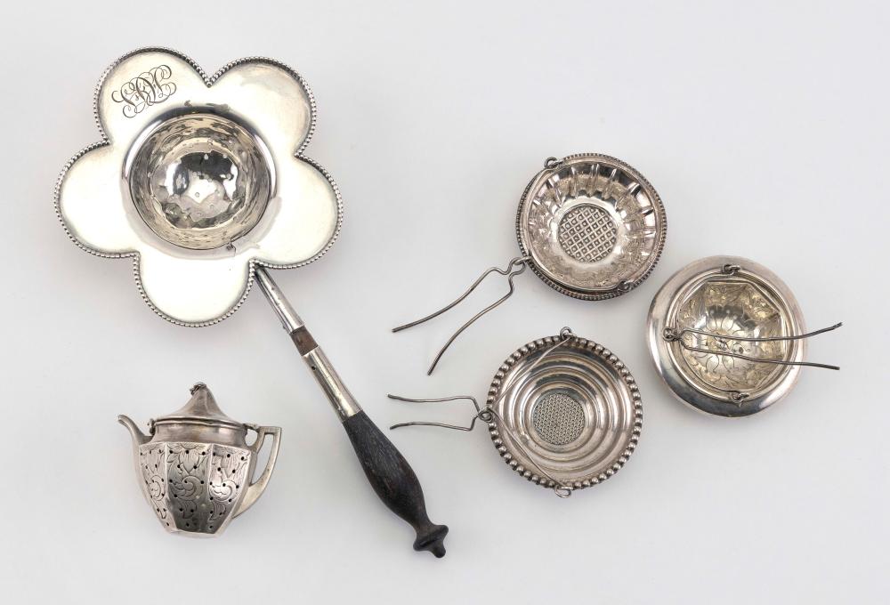 FIVE STERLING SILVER TEA STRAINERS