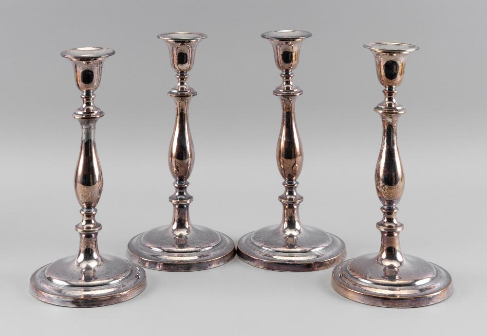 FOUR MATCHING SILVER PLATED CANDLESTICKS