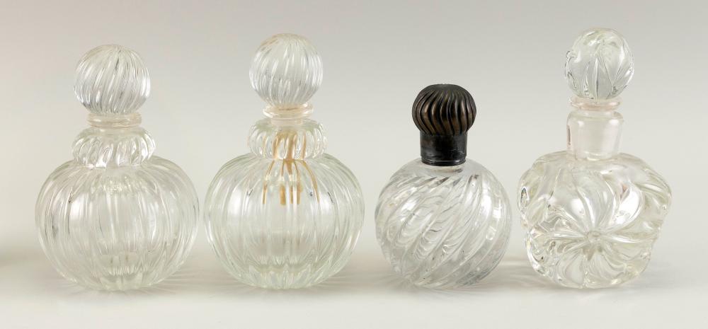 FOUR CLEAR GLASS COLOGNE BOTTLES
