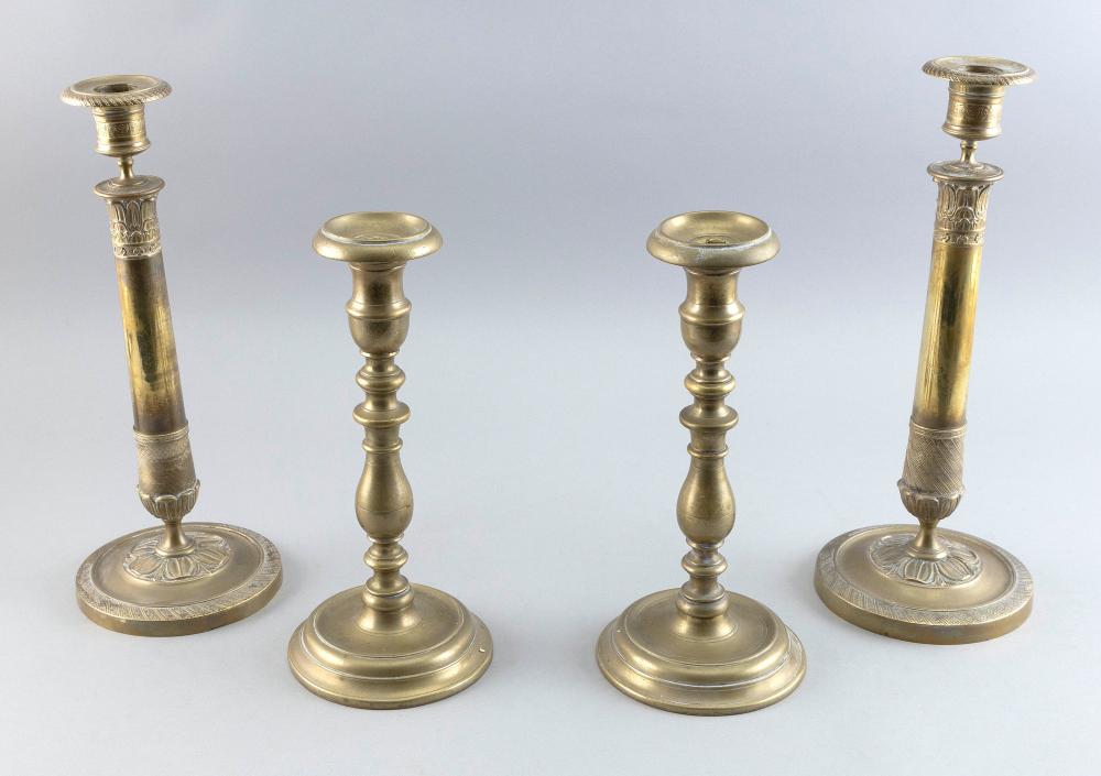 TWO PAIRS OF EARLY BRASS CANDLESTICKS