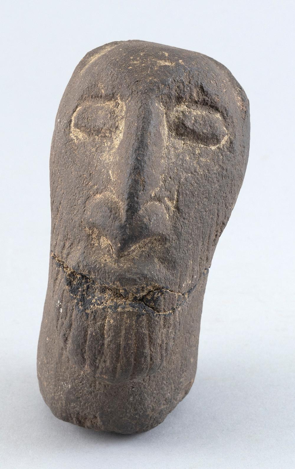 CARVED STONE HEAD OF A BEARDED