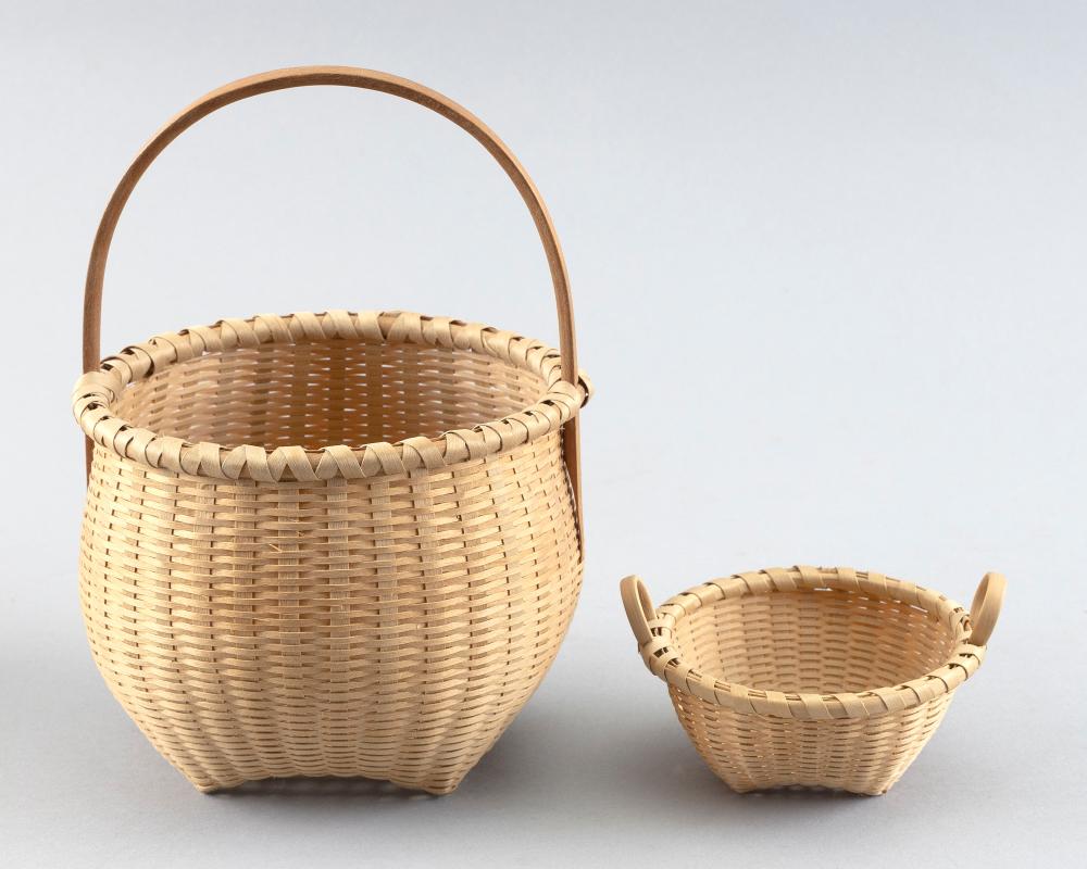 TWO WOVEN BASKETS BY JOAN CASHIN