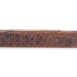 A Carved Wooden Folk Art Knife Sharpener
Dated