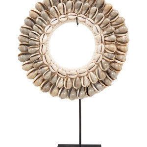 A Contemporary Cowrie Shell Ornament
Height