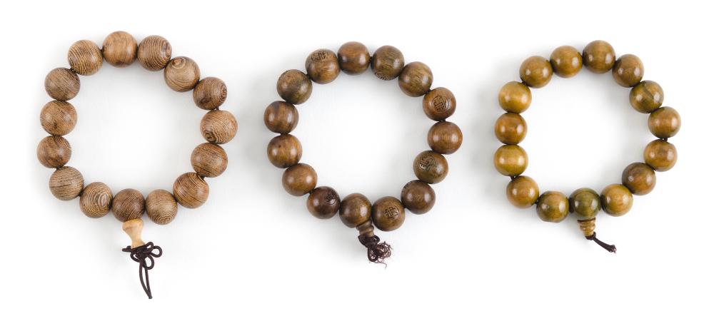 THREE CHINESE TIGER S EYE BRACELETS 35124f