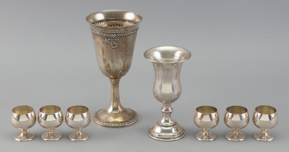 EIGHT STERLING SILVER DRINKING GLASSES