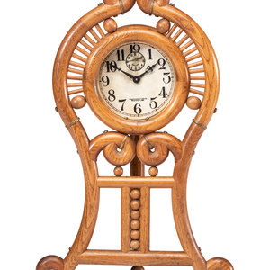 A Stick and Ball Oak Mantel Clock
with