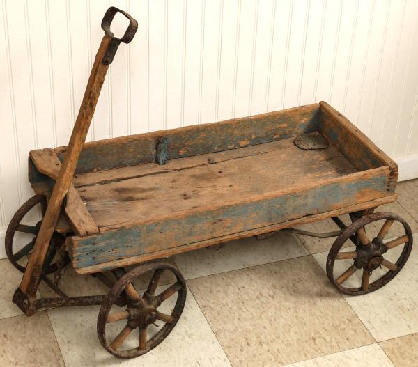 A 1900S IRON WHEELED COASTER WAGON