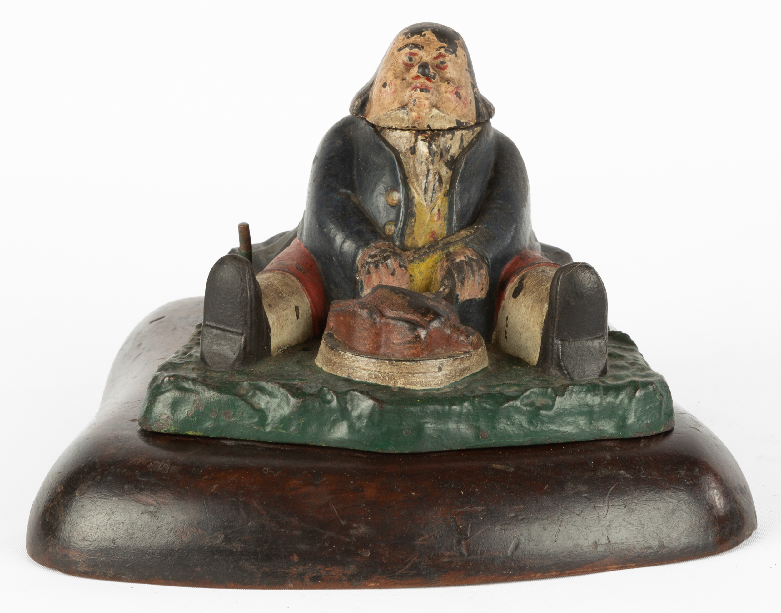 CAST IRON INKWELL OF GLUTTON DANIEL