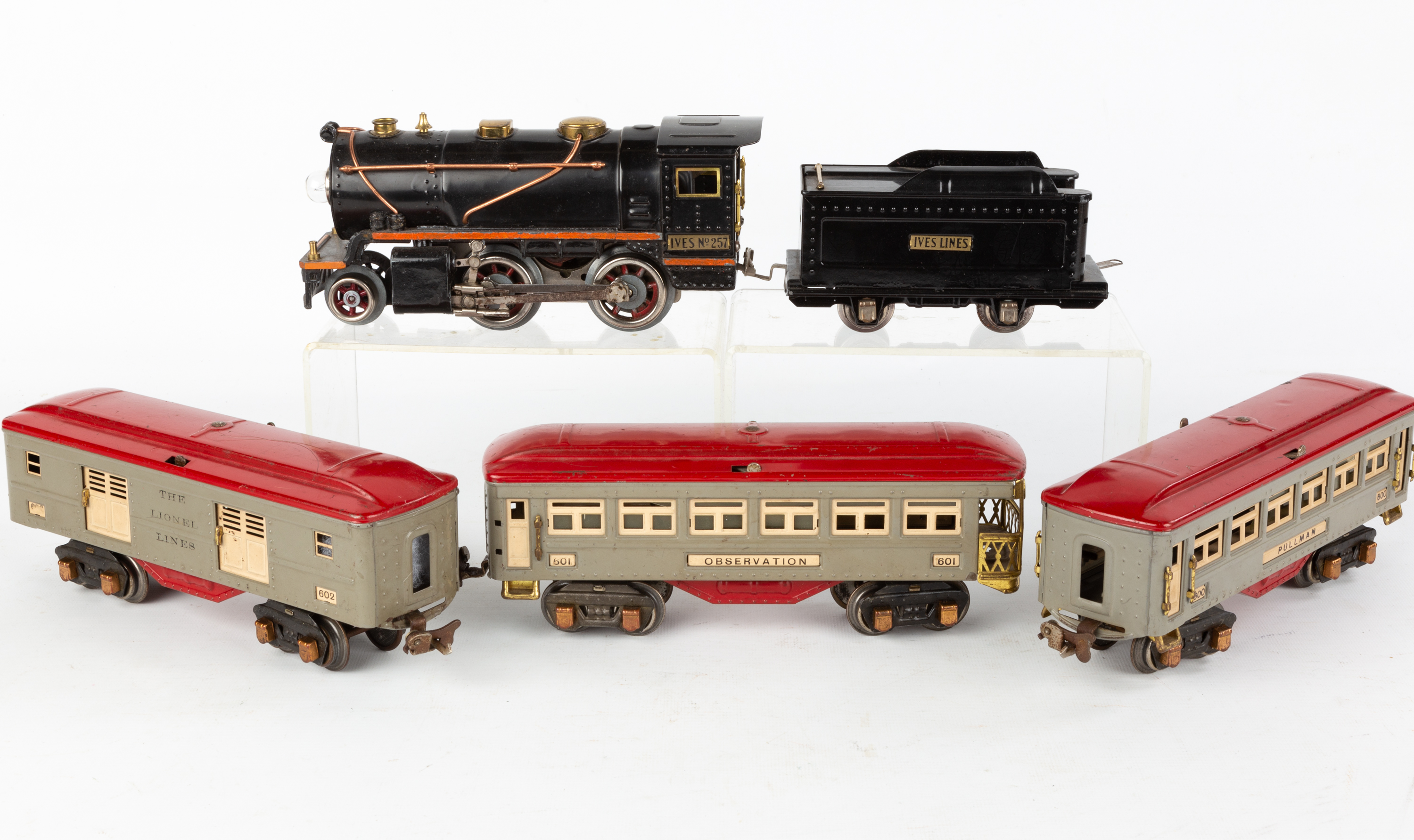IVES ENGINE WITH THREE LIONEL CARS