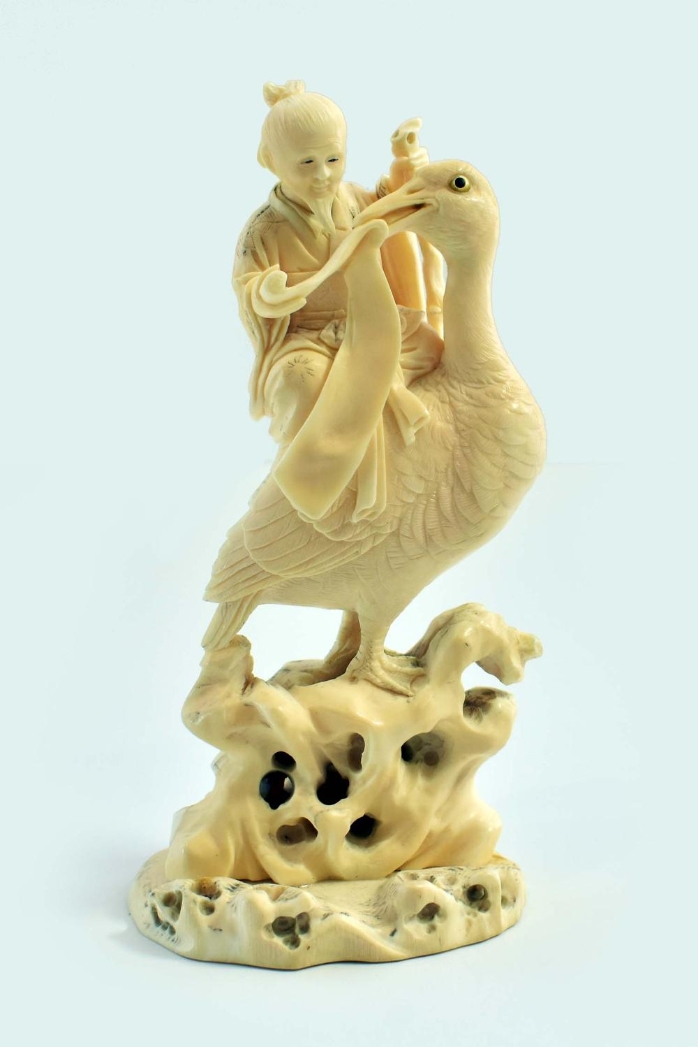 CHINESE CARVING OF A SCHOLAR RIDING