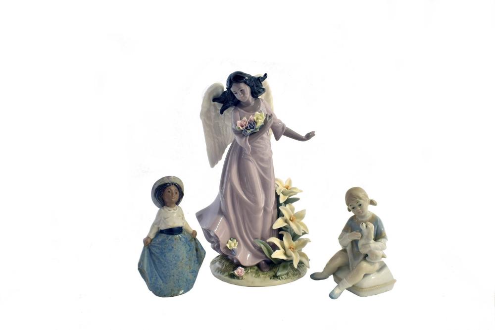 THREE PORCELAIN FIGURESThe first,