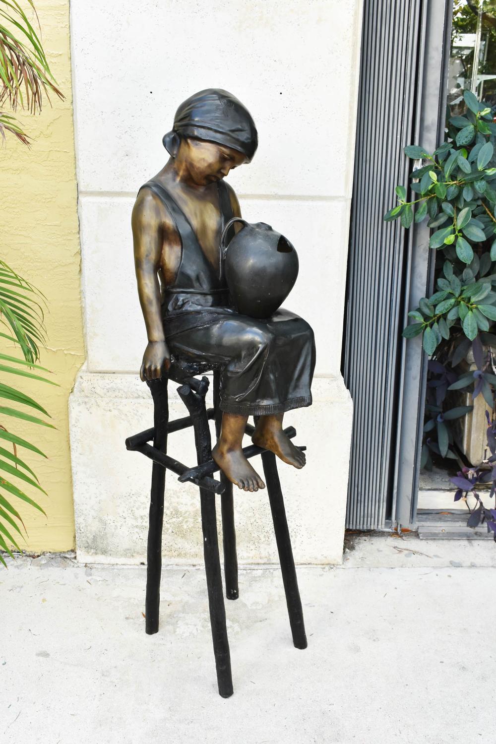 LARGE PATINATED BRONZE OF A GIRL SEATED