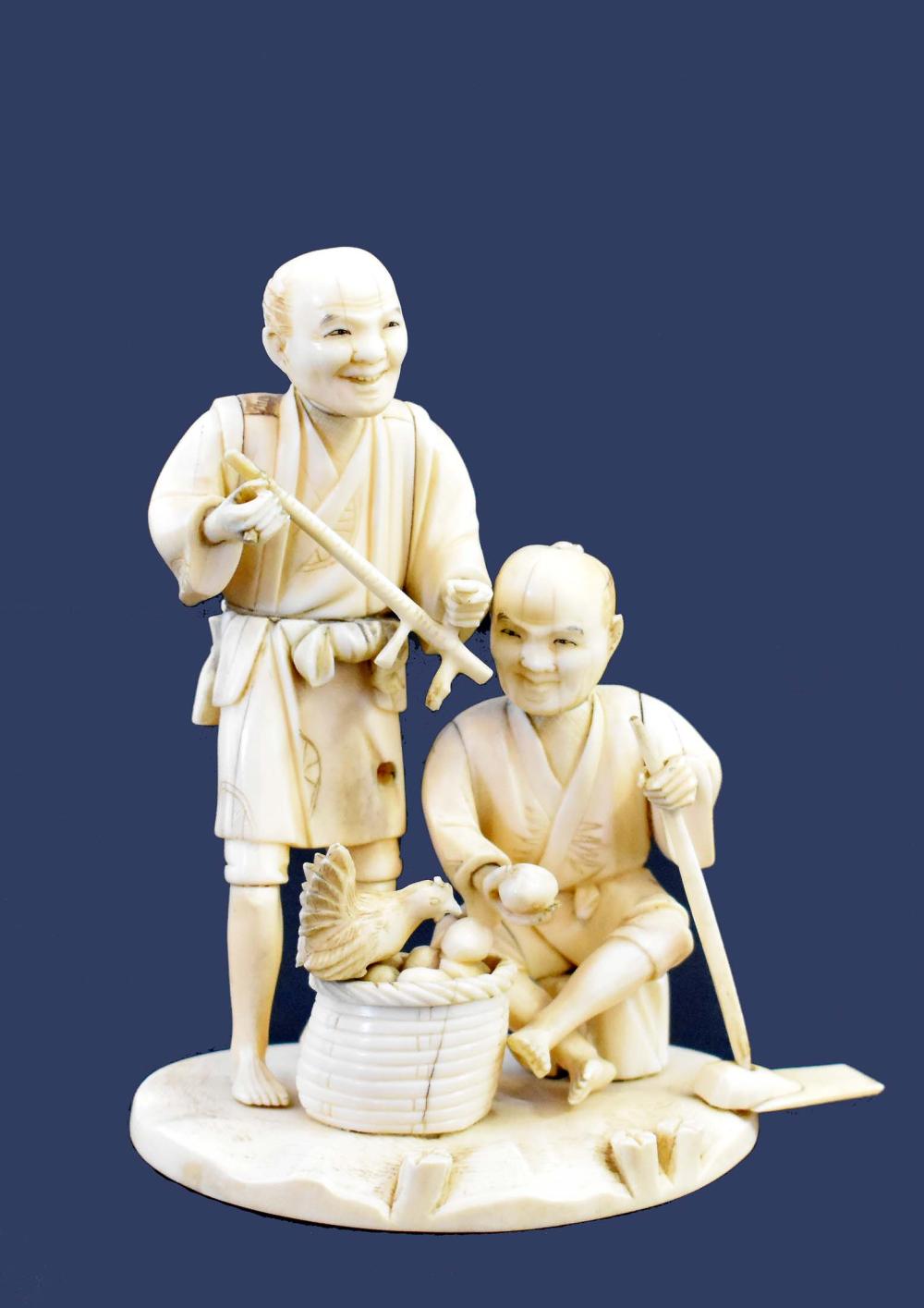 JAPANESE CARVED OKIMONO OF A FARMERAppears