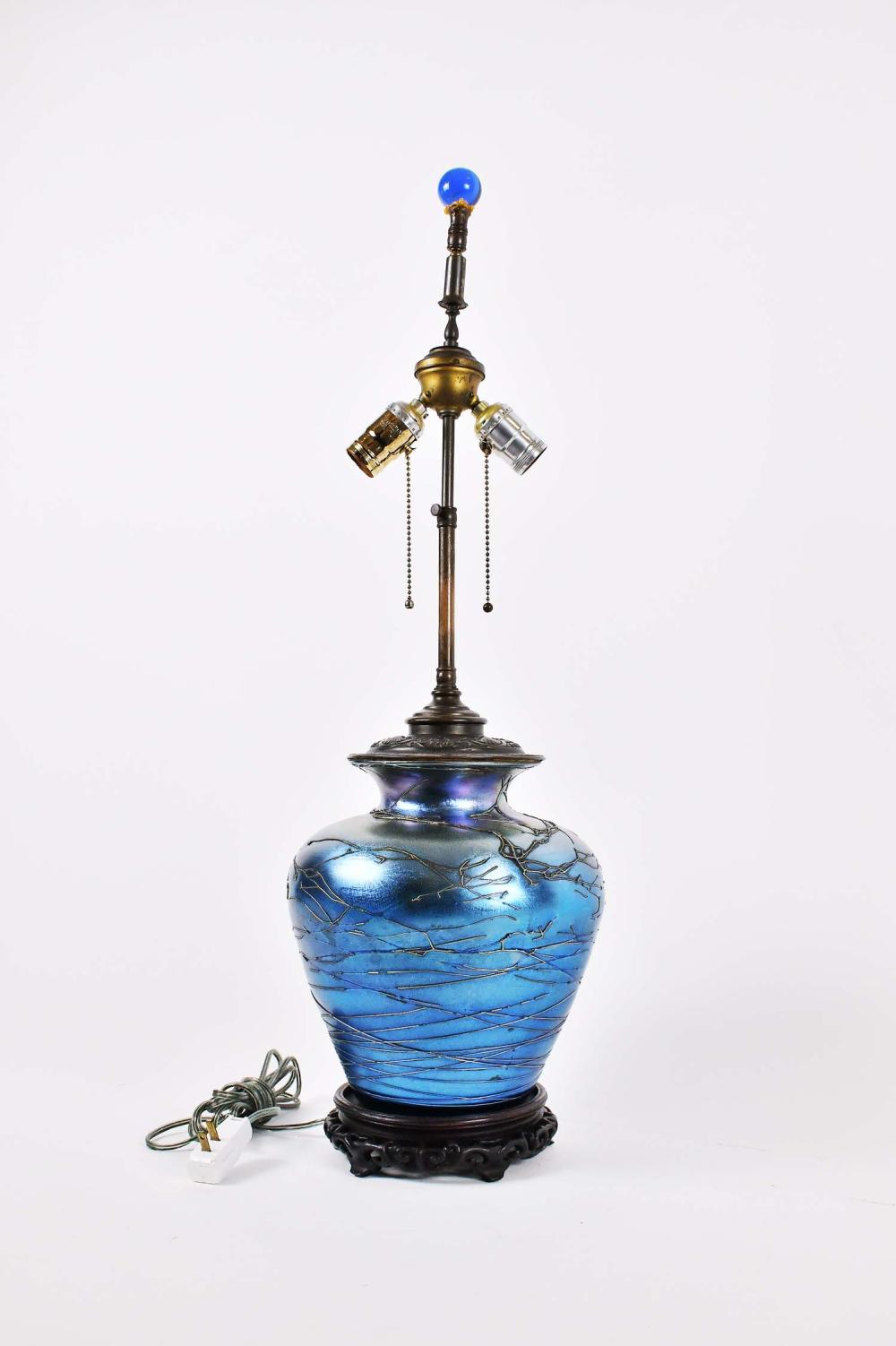 BLUE IRIDESCENT GLASS VASE MOUNTED AS