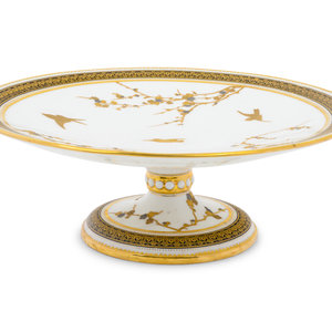 A Continental Parcel Gilt Porcelain