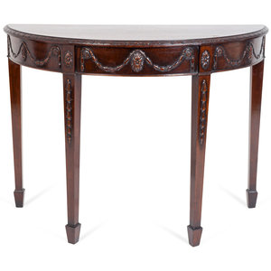 A George III Style Carved Mahogany