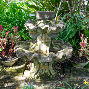 A Carved Stone Two Tier Shell Water