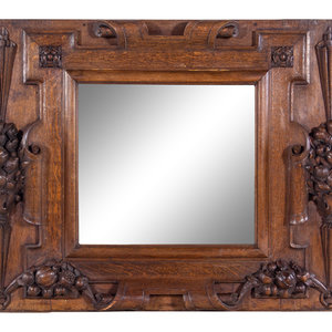 A Continental Carved Oak Mirror
Late