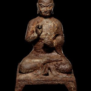 A Tibetan Cast Iron Figure of a