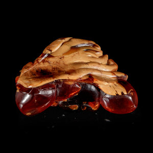 A Carved Amber Hand Citron-Form