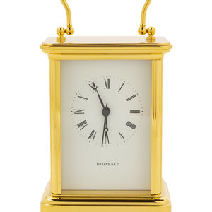 A Swiss Gilt Brass Carriage Clock Retailed
