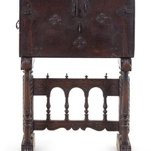 A Spanish Iron Mounted Carved Walnut