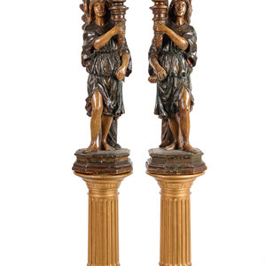 A Pair of Continental Carved and