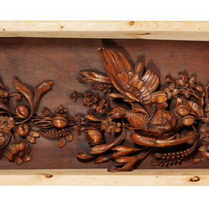 A Set of Three Carved Panels in