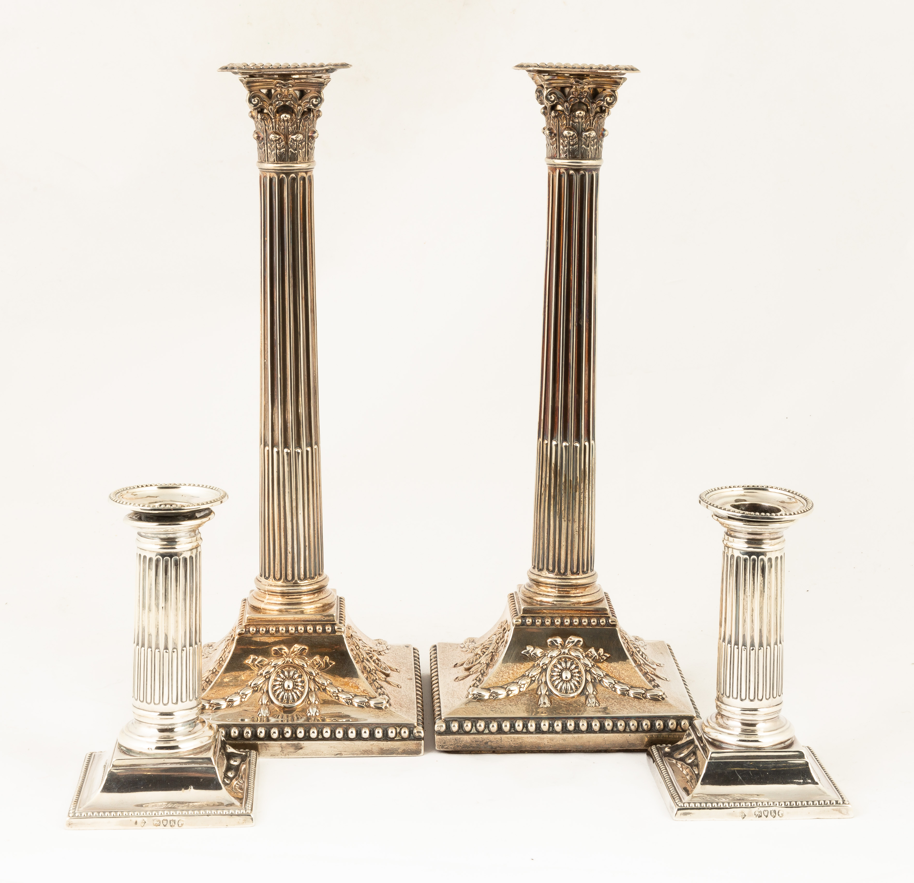 TWO PAIR OF STERLING SILVER CANDLESTICKS