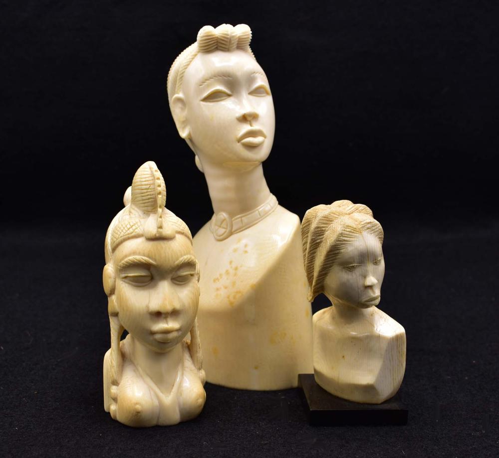 THREE AFRICAN CARVED BUSTSEach