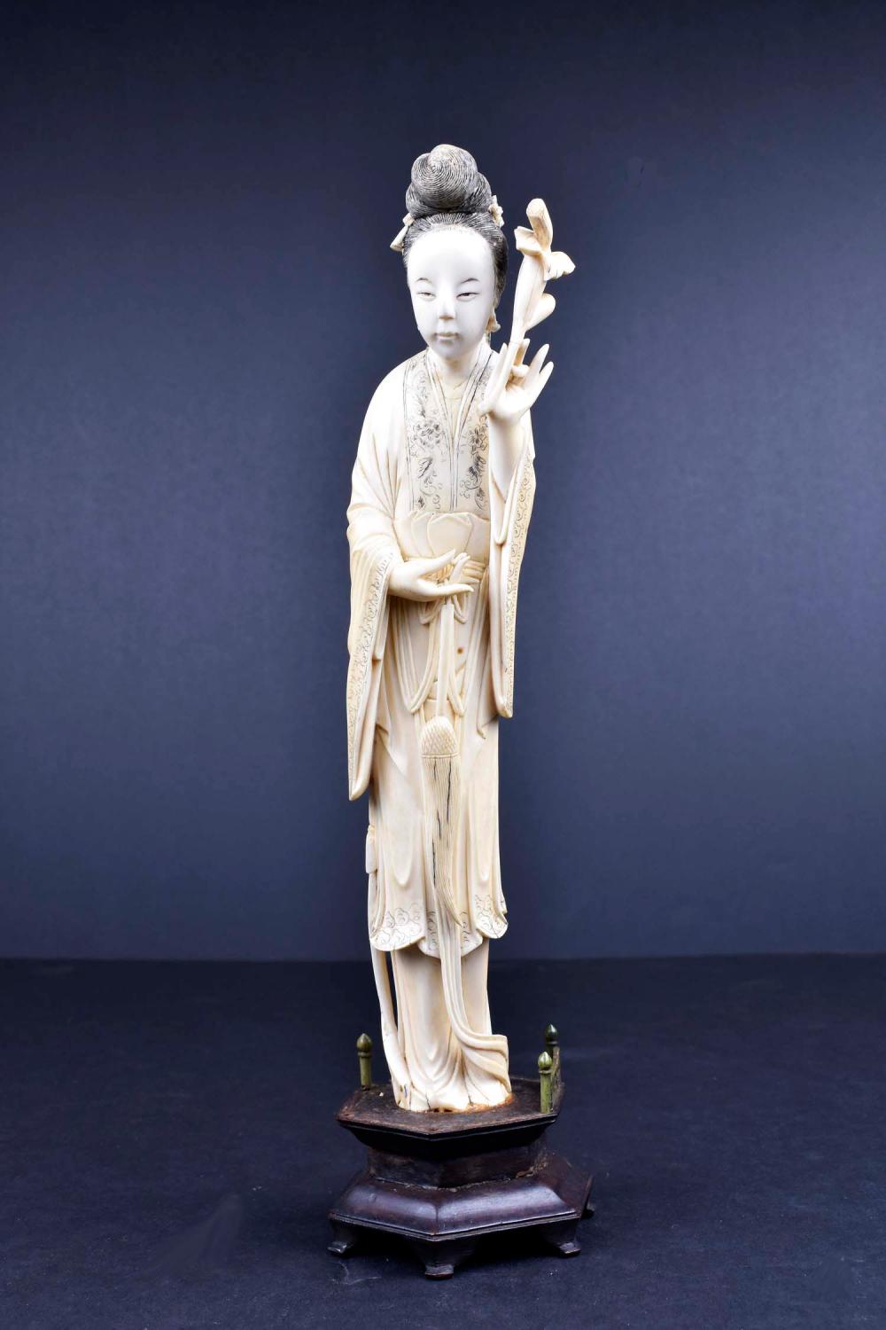 CHINESE CARVED FIGURE OF A MEIRENElegantly