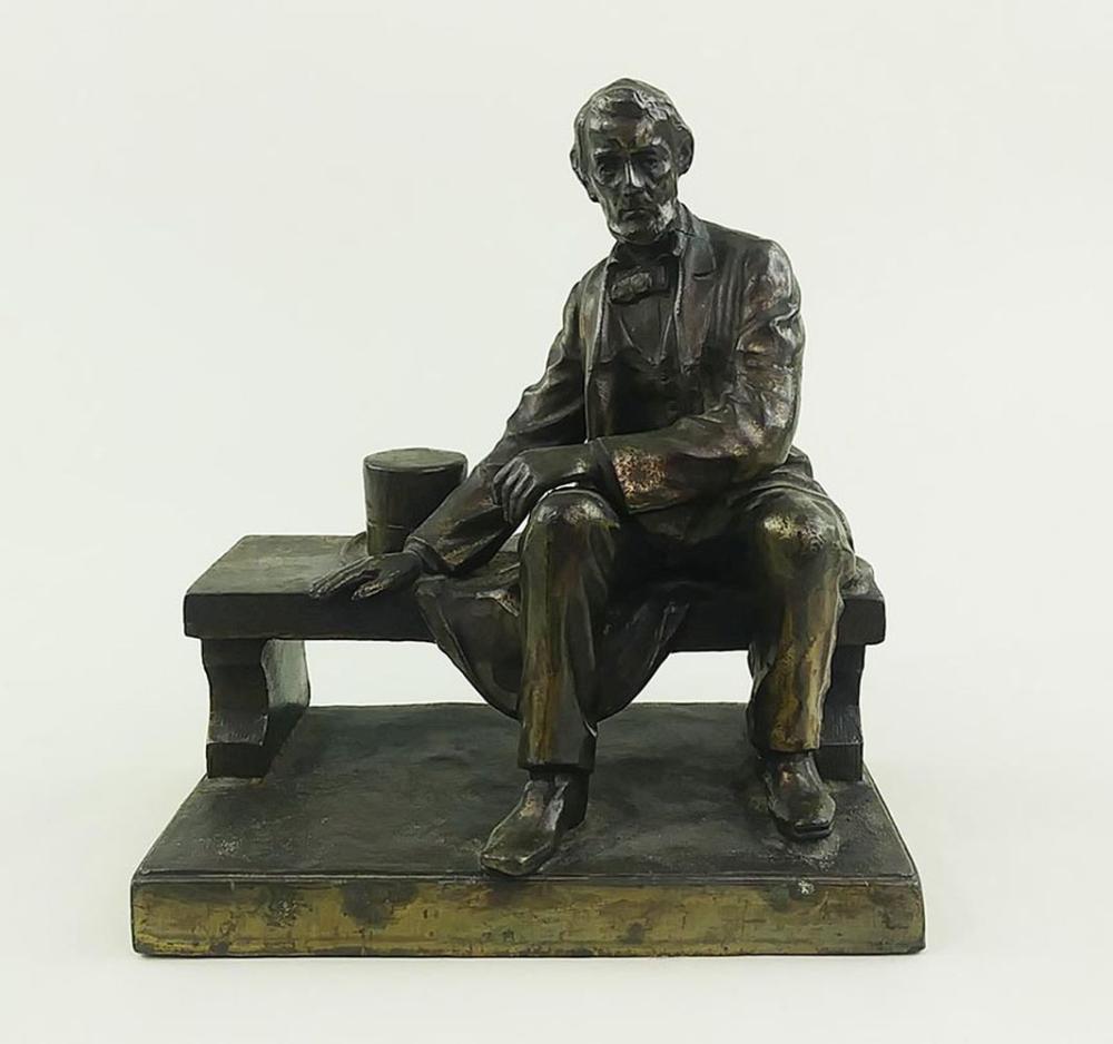 BRONZE CLAD METAL FIG OF LINCOLN SEATED