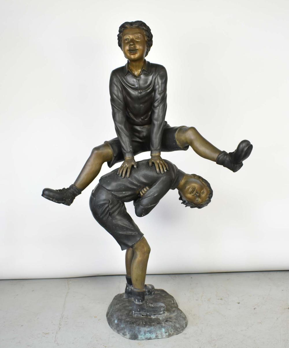 PATINATED BRONZE OF TWO BOYS PLAYING