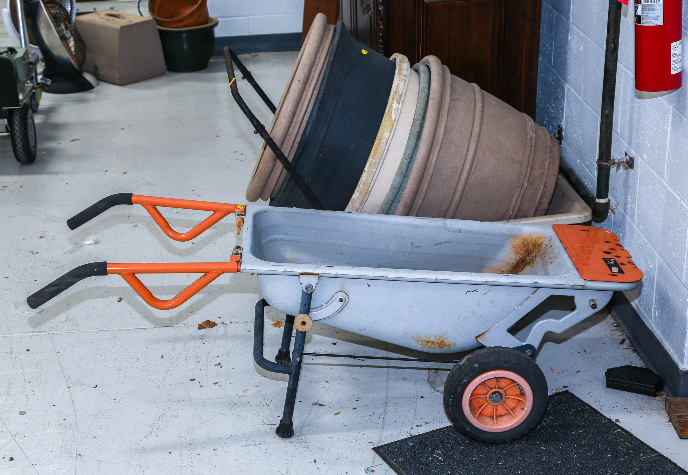 TWO GARDEN WHEELBARROWS & PLANTERS