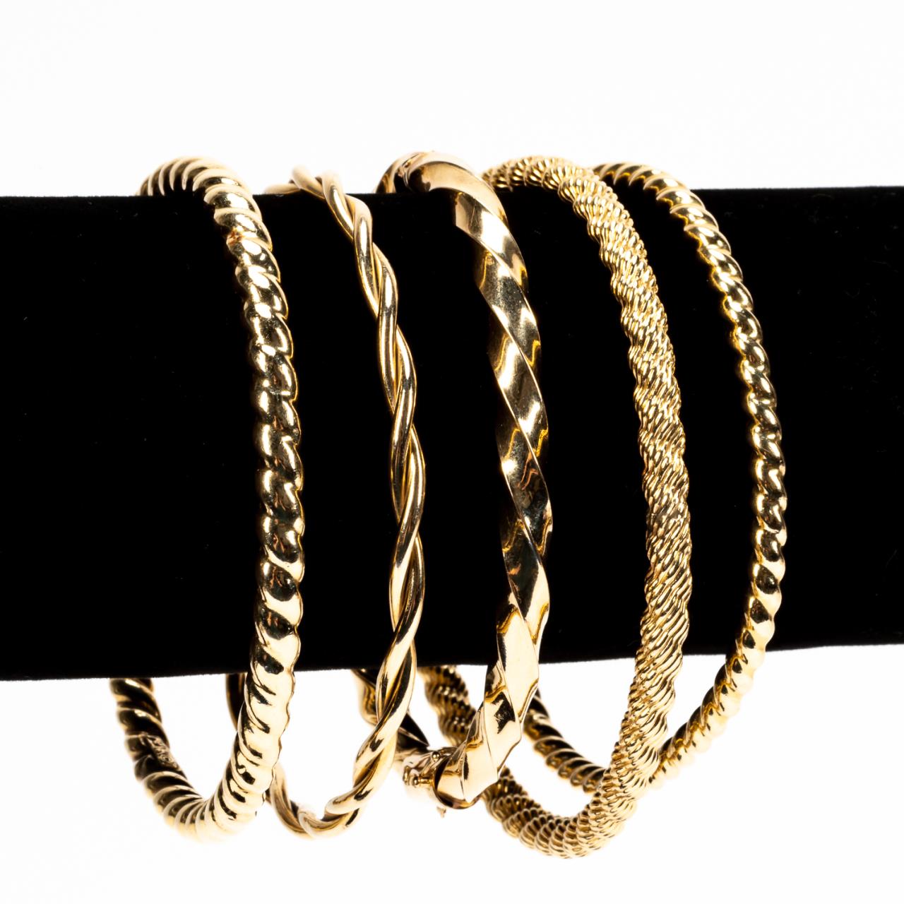 FIVE 14K YELLOW GOLD TWIST BANGLE