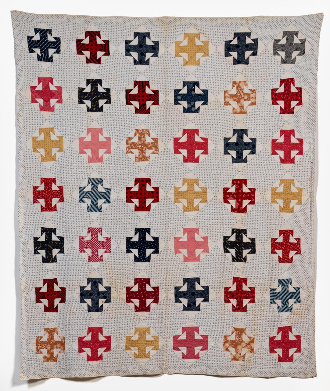 HAND QUILTED COTTON CROSS IN A