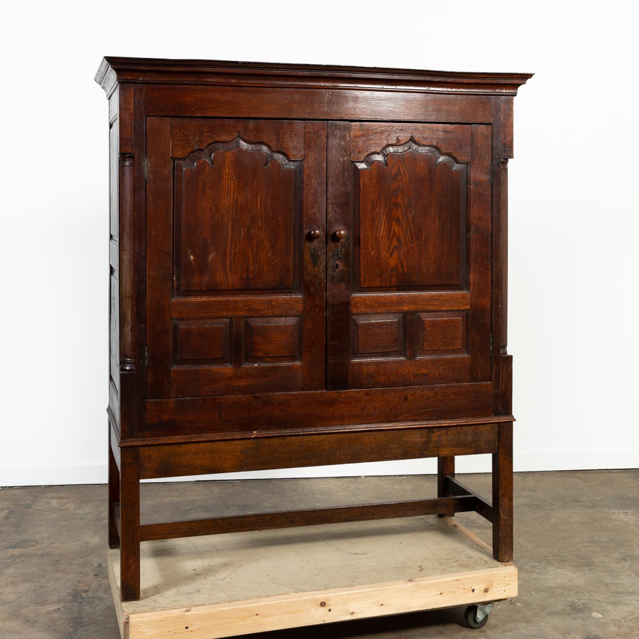 ENGLISH OAK TWO-DOOR CABINET ON