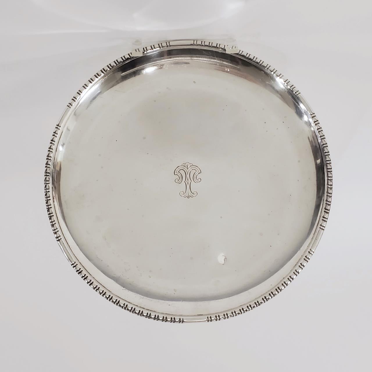 CARTIER, STERLING SILVER ROUND