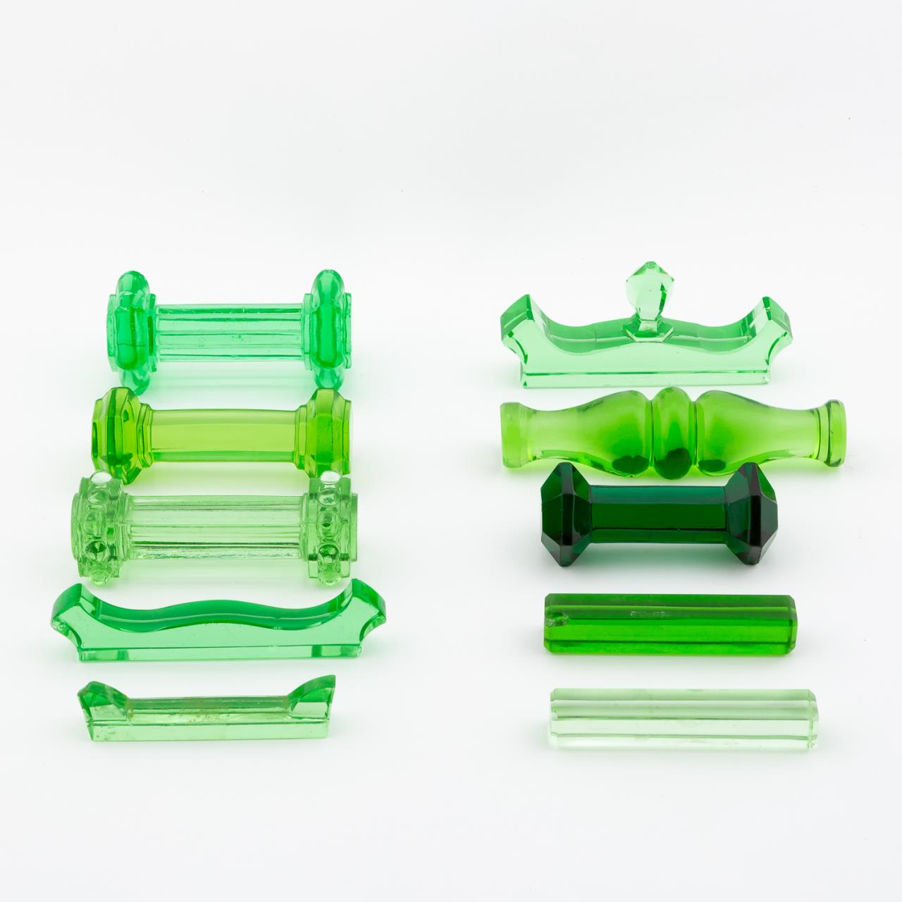 TEN MISC. GREEN GLASS KNIFE RESTS