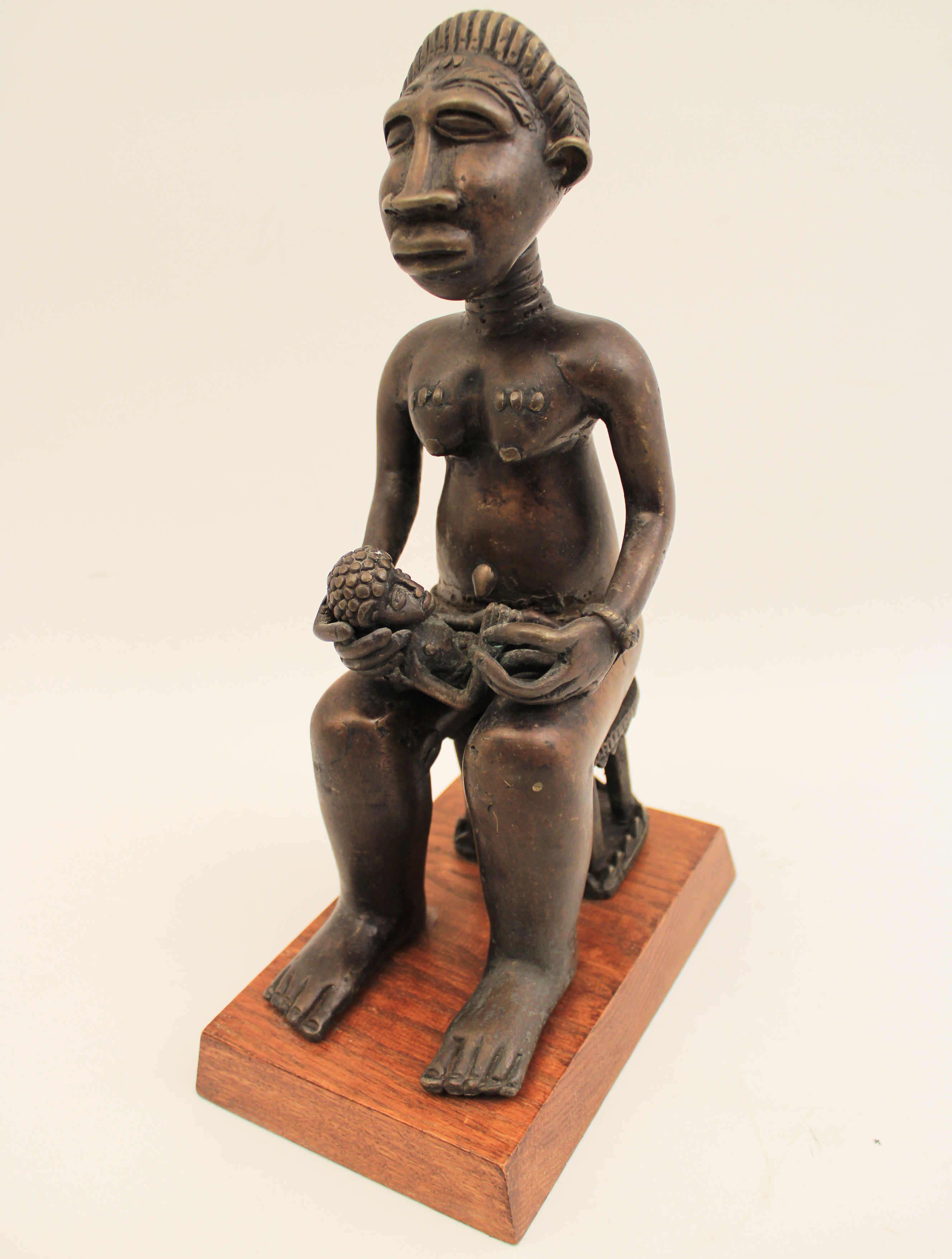 AFRICAN BRONZE SCULPTURE OF SEATED MOTHER