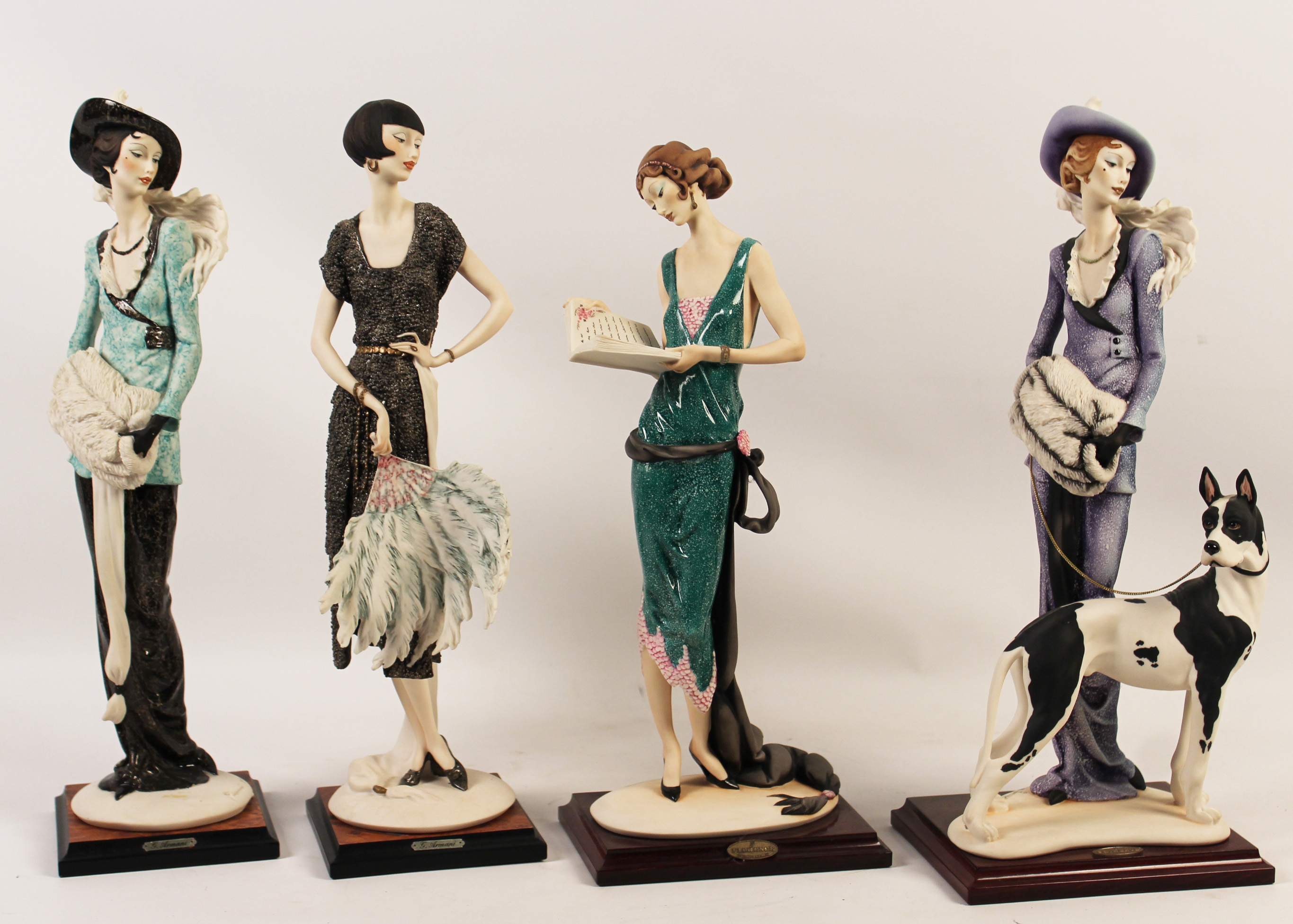 GROUPING OF 4 GIUSIPPE ARMANI FIGURES