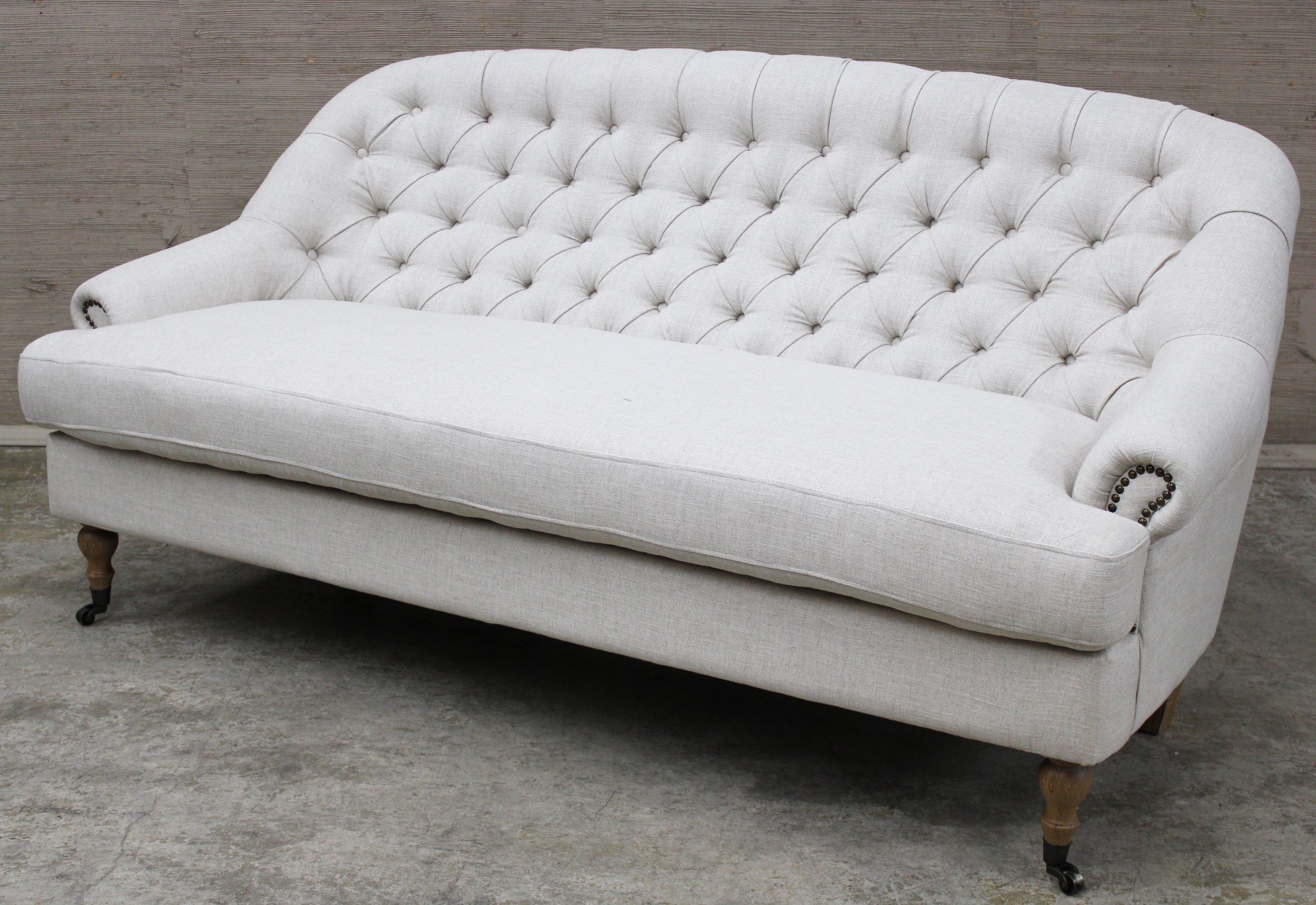 UPHOLSTERED SCROLL ARM SOFA Tufted