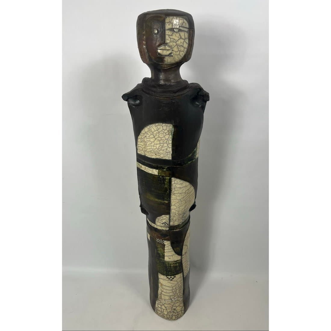 Tall abstract pottery sculpture.