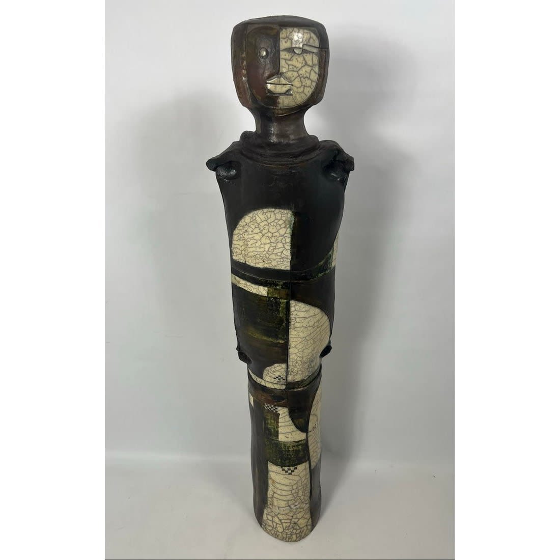 Tall abstract pottery sculpture. Figural