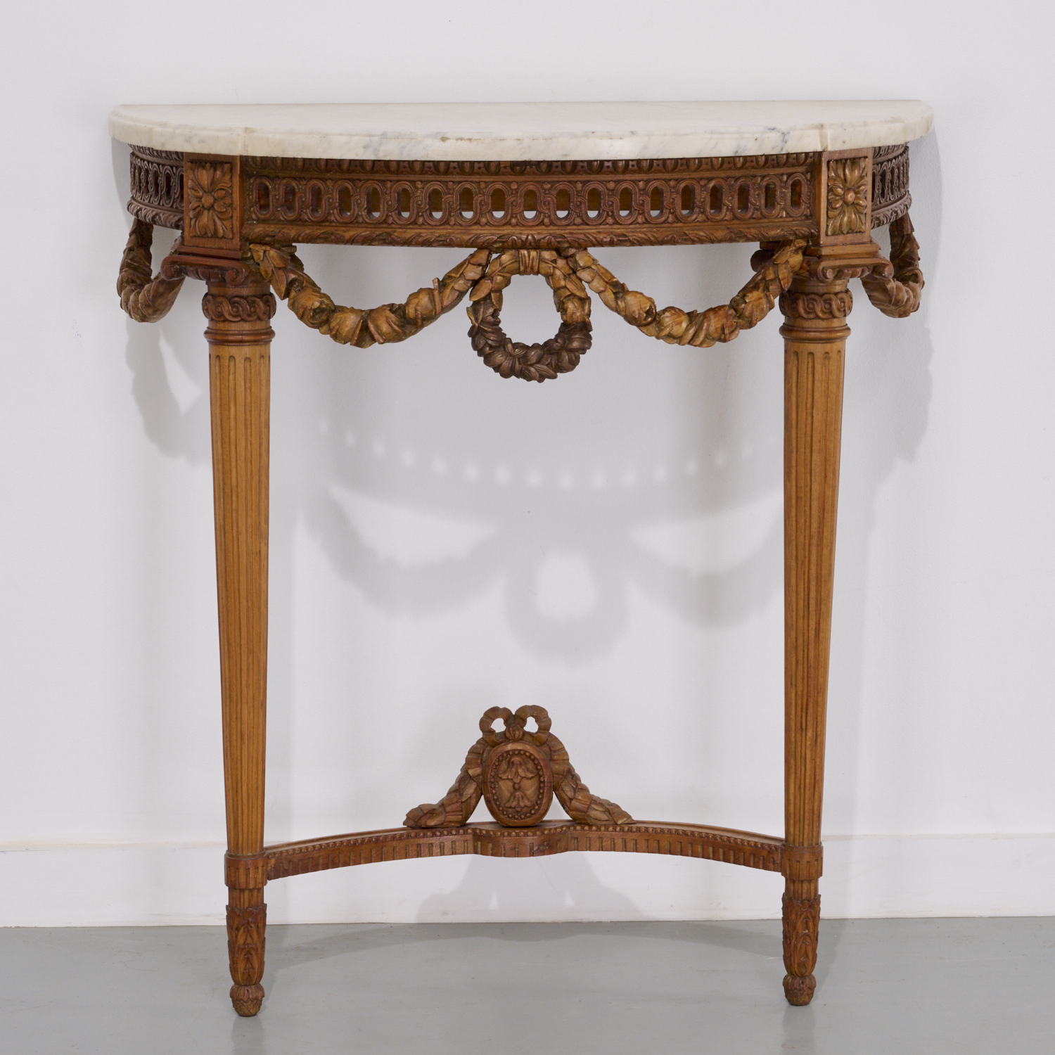 LOUIS XVI STYLE CARVED WALNUT DEMILUNE