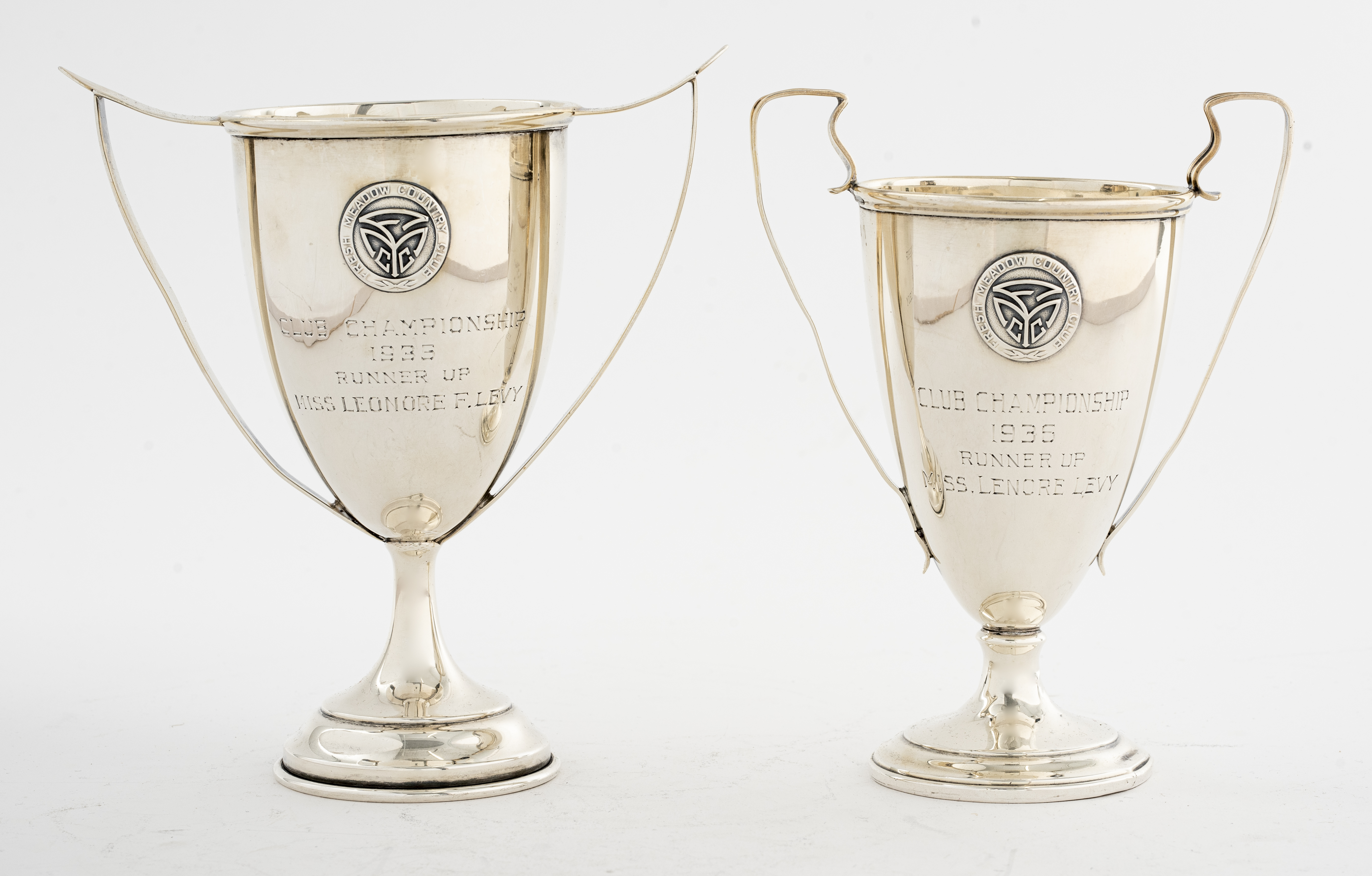 TWO STERLING SILVER TROPHY CUPS